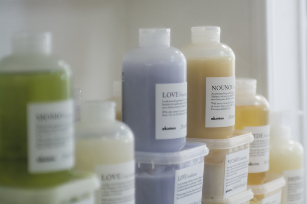 Davines shampoos and conditioners on the salon shelf